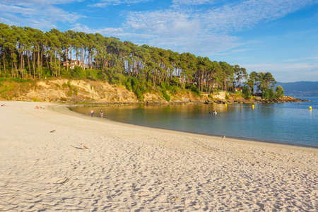 Baltar beach and pine forest over Bicano cape in Portonovo village, Sanxenxo town