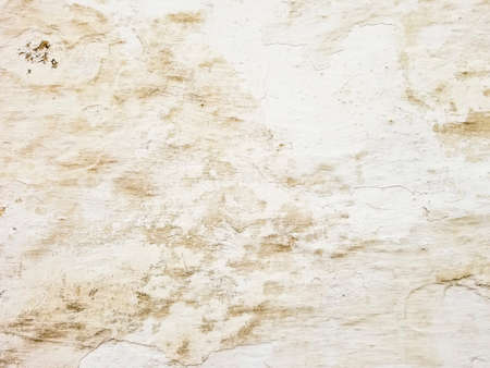 Background and texture of the old and whitewashed wall of an ancient house