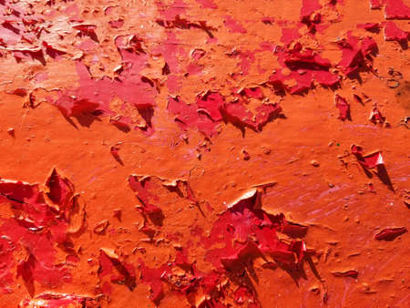 Background and texture of red peeling paint surface