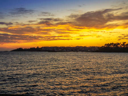 Golden and cloudy dusk over Portonovo village in Sanxenxo town, Galicia, Spainの写真素材