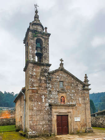 Facade and bell tower of Santa Cristina of Covas romanesque  church in Meaho town, Galicia, Spainの写真素材