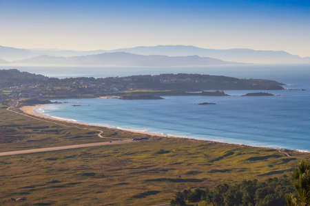 Aerial view of La Lanzada beach and Punta Faxilda capeの写真素材
