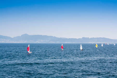 Sailboats sailing in a regatta on the sea in Sanxenxo, Pontevedra estuaryの写真素材