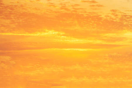 Cloudy and gonden sunset bacground