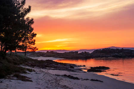Area da Secada beach in Arousa Island at colorful duskの写真素材