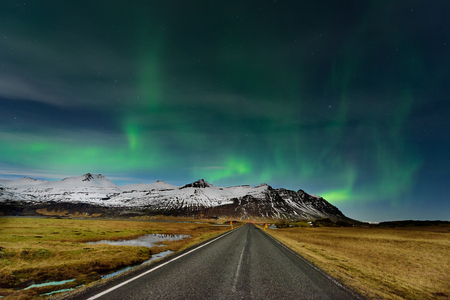 The Northern Light at the mountain in Iceland. Landscape with green bands of Aurora Borealis. Nightscape magical.の写真素材