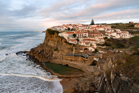 View of the Picturesque village Azenhas do Mar, on the edge of a cliff with a beach below. Landmark near Sintra, Lisbon, Portugal, Europe. landscape at sunset.のeditorial素材