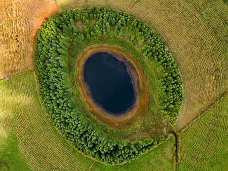 Aerial view of beautiful lagoon in the Azores islands. Drone landscape view with lines and textures in the background. Top view of volcanic crater, tourist attraction of Portugal.の写真素材
