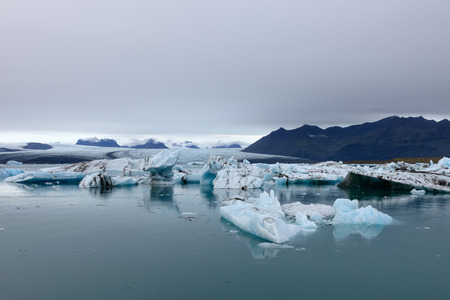 Jokulsarlon glacier lagoon, Iceland at sunset. Beautiful glaciers flow through the mountains. Cold...