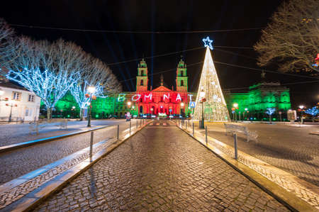 December night with Christmas lights at the National Palace of Mafra in Mafra village near Lisbon. Convent and Basilica of Portugal. Christmas light show.のeditorial素材