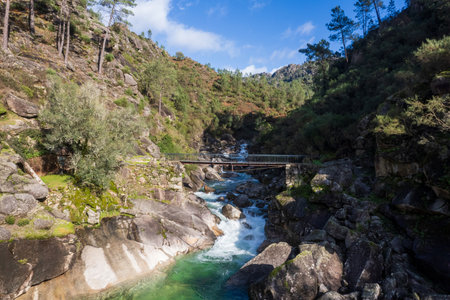 Peneda Geres National Park Portugal. Tahiti waterfalls. Scenic landscape, wild river. Its rugged hills are home to deer, wolves and golden eagles. The trails include a Roman road lined with landmarks.の写真素材