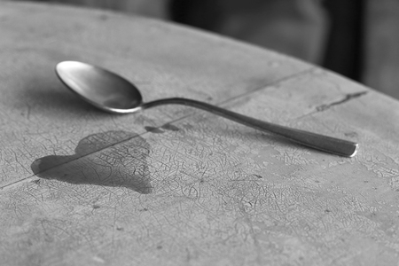 Teaspoon of coffee shape of heartの写真素材