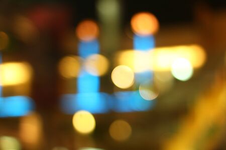 Blurred bokeh of car in city at night