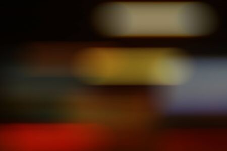 Blurred bokeh of car in city at nightの写真素材