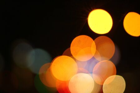 Blurred bokeh of car in city at night