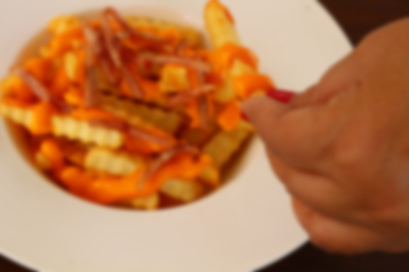 Blur French fries with cheese sauceの写真素材
