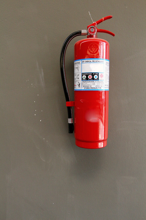Fire safety or extinguisher on wallの写真素材