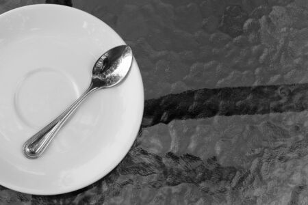 Place setting with plate spoonsの写真素材