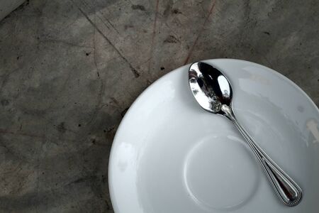 Place setting with plate spoons