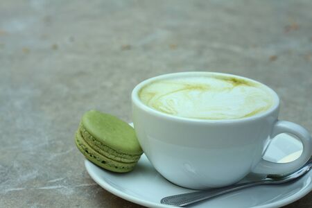 Green tea and milk with macaroon