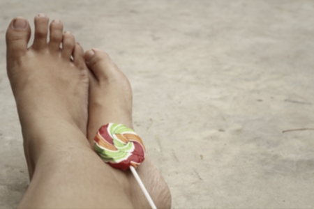 blur colorful of candy on my footの写真素材