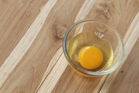 eggs in a bowl on the tableの写真素材