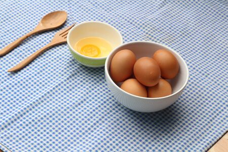 eggs in a bowl on the tableの写真素材