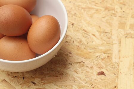 eggs in a bowl on the tableの写真素材