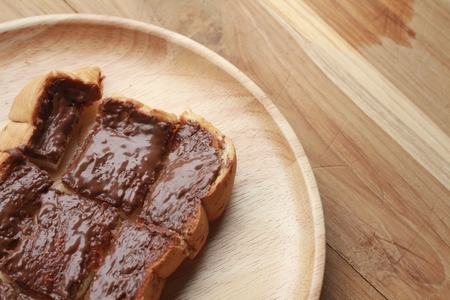 Toast bread topped with chocolate and butter.の写真素材