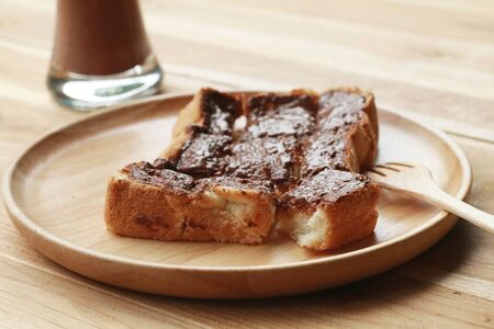 Toast bread topped with chocolate and butter.の写真素材