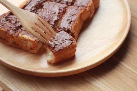Toast bread topped with chocolate and butter.の写真素材