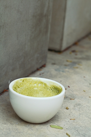 Matcha green tea latte beverage in glassの写真素材