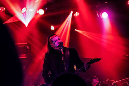 Krakow, Poland - September 20, 2014: An artist playing guitar in an open rock band music concert performance.のeditorial素材