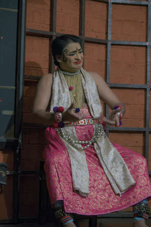 Kochi, India - March 15, 2014: An Indian classical dance form named Kathakali artists tells Indian mythological stories through numerous gestures techniques and emotions in front of European tourists in South India.のeditorial素材