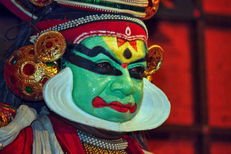 Kochi, India - March 15, 2014: An Indian classical dance form named Kathakali artists tells Indian mythological stories through numerous gestures techniques and emotions in front of European tourists.のeditorial素材