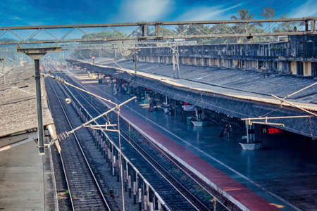 A side ariel view of an Indian railway station platform before blue skyの写真素材