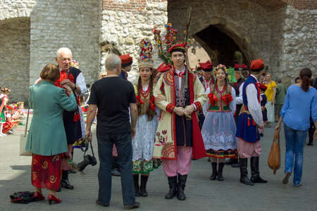 Krakow, Poland - May 03, 2015: A group of folk musical artist in slavic polish traditional dress gathered in city centerのeditorial素材