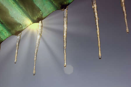 A view of frozen ice against sunny warm light during winter in Krakow, Poland Europe