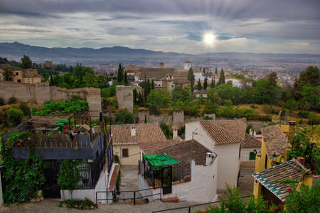 Beautiful scenic view of Granada city located in southern Spain, Andalusia against dramatic sunrise sunset, Europeのeditorial素材