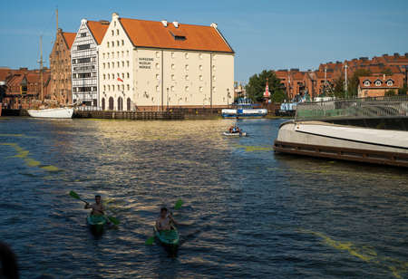 Gdansk, North Poland - August 13, 2020: Wide angle shot of Summer and people kayaking in motlawa...