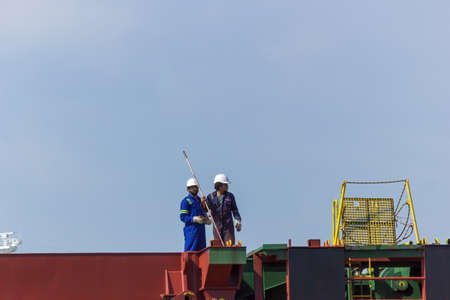 Gdansk, North Poland - August 14, 2020: industrial worker in motlawa river side ship yard performing as usual in summerのeditorial素材