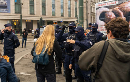 Krakow, Poland - October 25, 2020: Polish people gathered together wearing mask during pandemic in order to protest against a legislative proposal for a total ban of abortion in the main city centerのeditorial素材