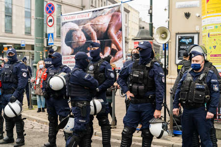 Krakow, Poland - October 25, 2020: Polish people gathered together wearing mask during pandemic in...