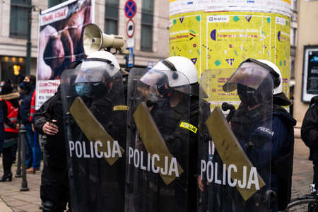 Krakow, Poland - October 25, 2020: Polish police on duty wearing mask during pandemic to maintain...