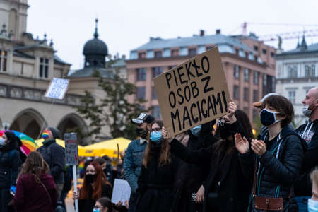 Krakow, Poland - October 25, 2020: Polish people gathered together wearing mask during pandemic in order to protest against a legislative proposal for a total ban of abortion in the main city centerのeditorial素材