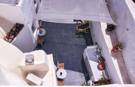 Santorini, Greece - September 11, 2017: Top view of one of the interior of a house and decorative...