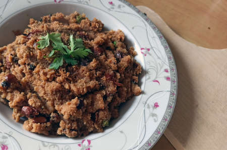 Close up shot of Dalia upma or broken wheat upma, South Indian breakfast food made with broken wheat...