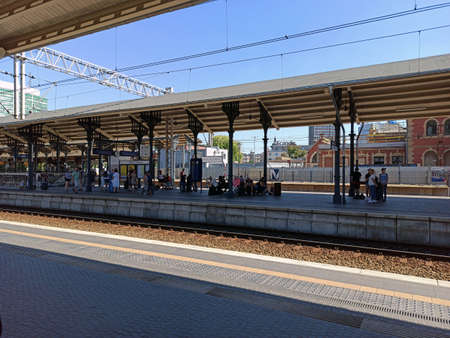 Gdansk, North Poland - August 14, 2020: View of intercity train station and tracks against bunch of...