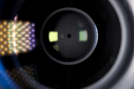 Camera lens close-up macro shot showing aperture blades. Media and photography concept background.の写真素材
