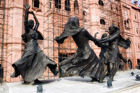 Amritsar, India - November 06, 2016: Dancing girls statue doing Punjabi folk group dance...